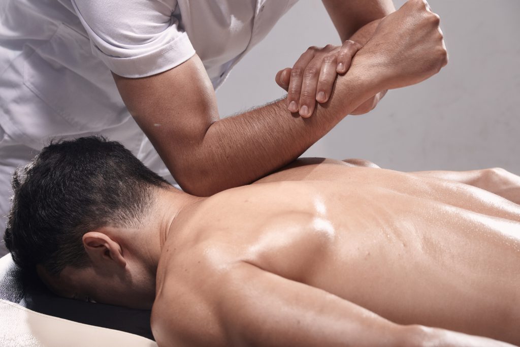 photo with a man receiving a deep tissue massage 
